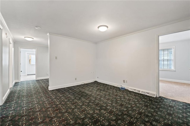 empty room featuring carpet flooring and ornamental molding