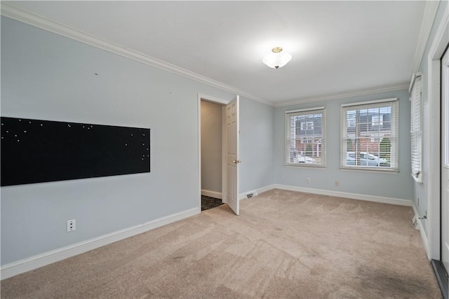 unfurnished room featuring light colored carpet and ornamental molding