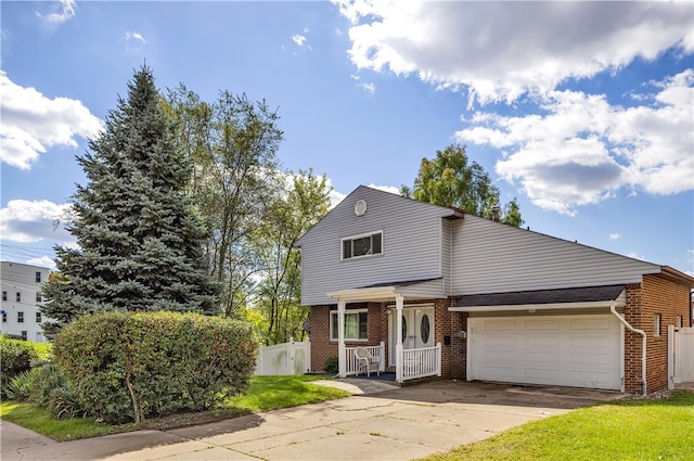 front of property featuring a garage and a front yard