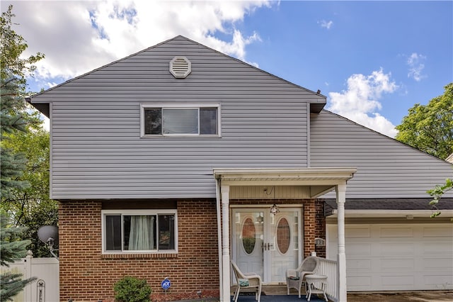 view of front of property with french doors and a garage