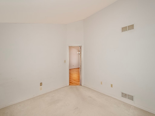 empty room with light colored carpet