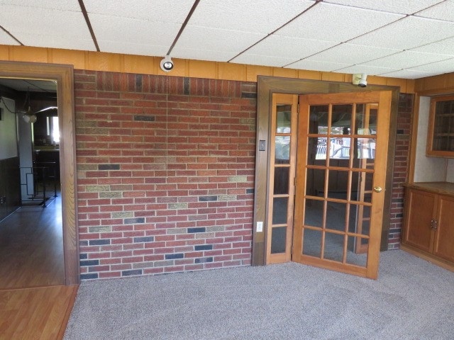 interior space featuring wood walls