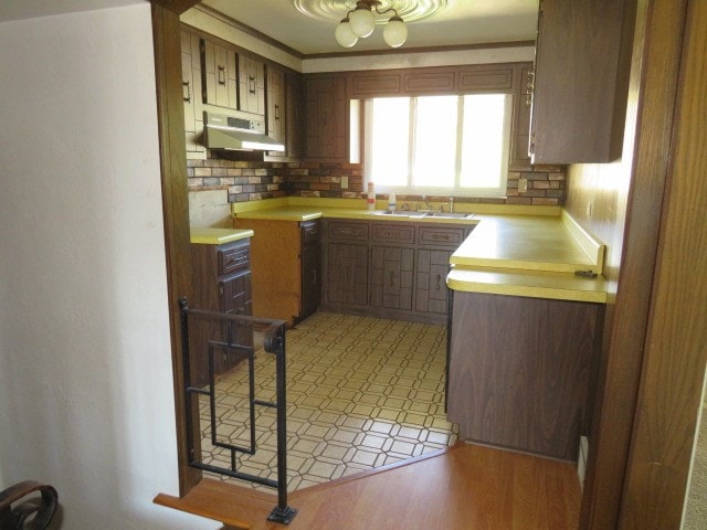 kitchen with ceiling fan, sink, and tasteful backsplash