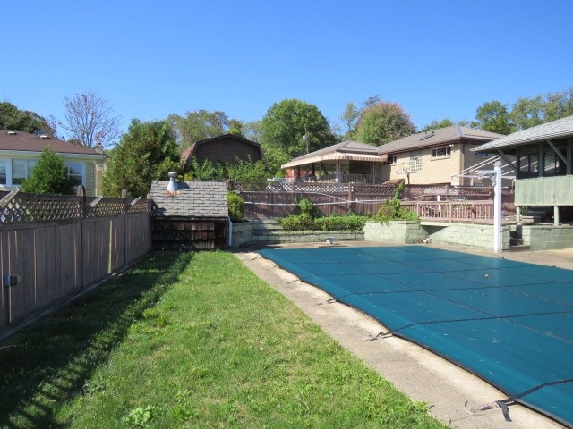 view of pool with a yard and a patio