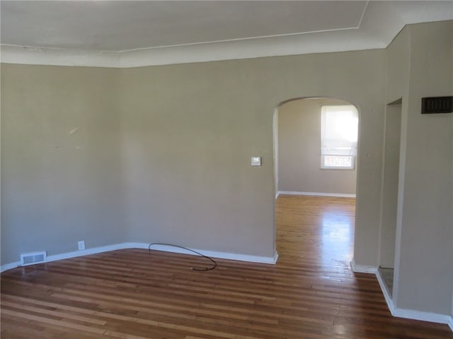 empty room with dark wood-type flooring