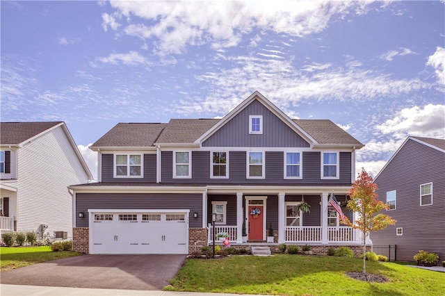 craftsman-style house with a garage, a front lawn, and a porch