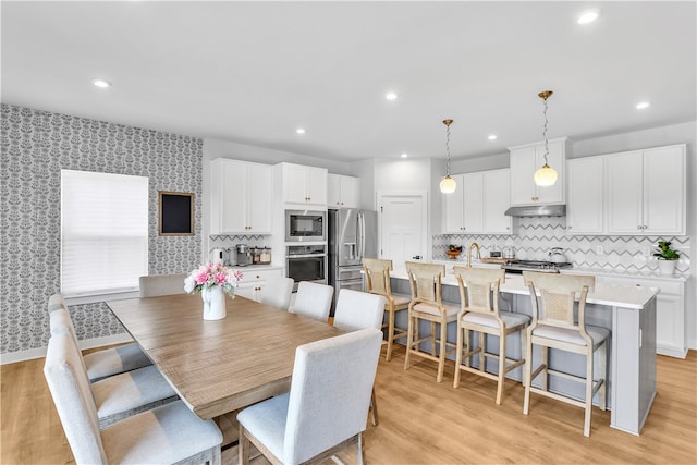 dining room with light hardwood / wood-style floors