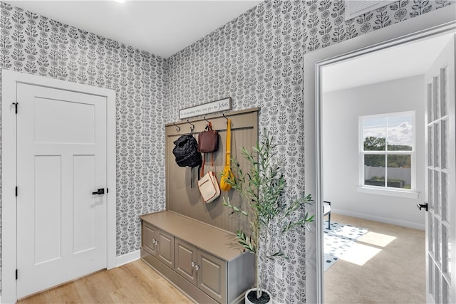 mudroom with light hardwood / wood-style flooring