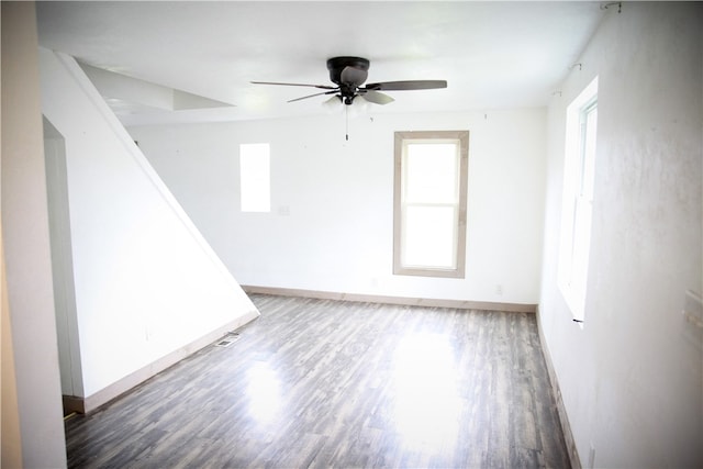 spare room with ceiling fan and wood-type flooring