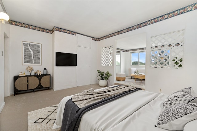 bedroom with light colored carpet