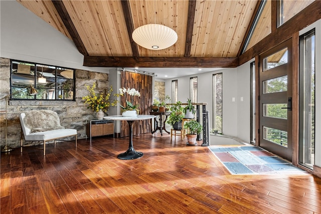 entryway with wooden ceiling, high vaulted ceiling, hardwood / wood-style floors, and beam ceiling