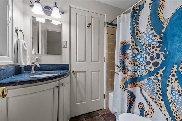 full bathroom featuring shower / bath combo, toilet, and vanity