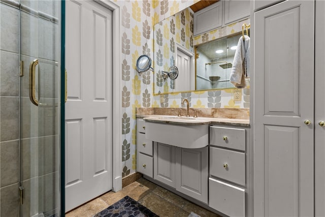 bathroom with an enclosed shower, backsplash, and vanity