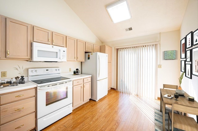 kitchen featuring lofted ceiling, white appliances, light brown cabinetry, and light hardwood / wood-style flooring