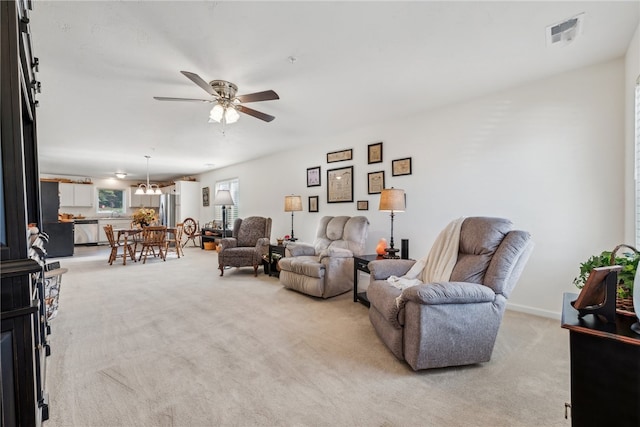 living room with light carpet and ceiling fan