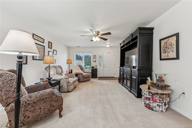 living room with ceiling fan and carpet flooring