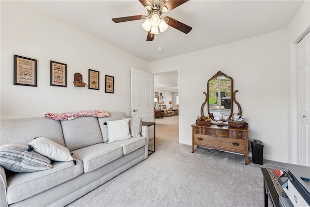 living room with light carpet and ceiling fan