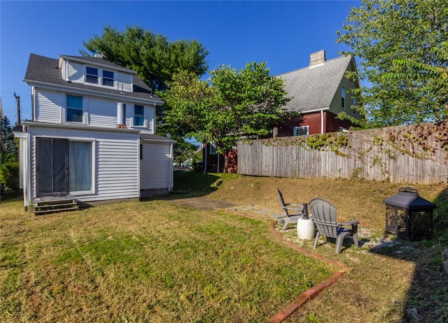 view of yard with a fire pit