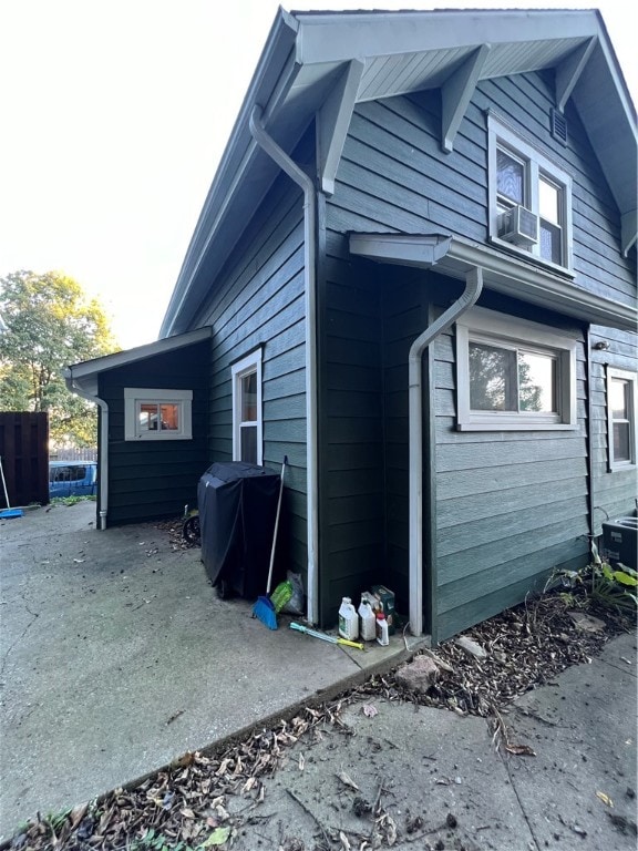 view of home's exterior with cooling unit and central AC