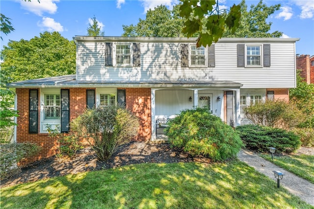 view of front of property with a front lawn