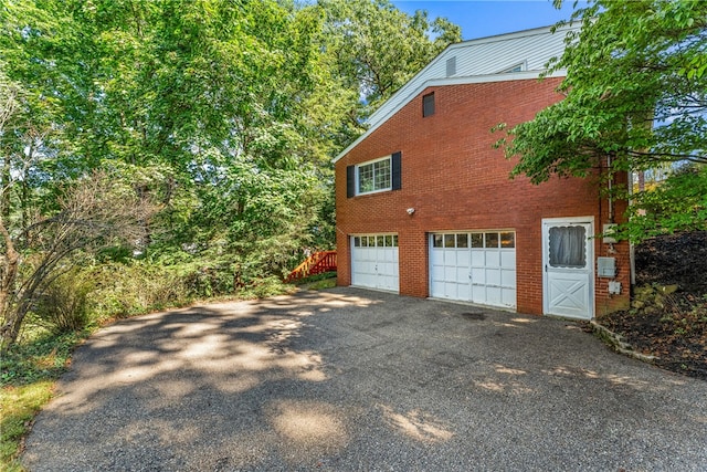 view of property exterior with a garage