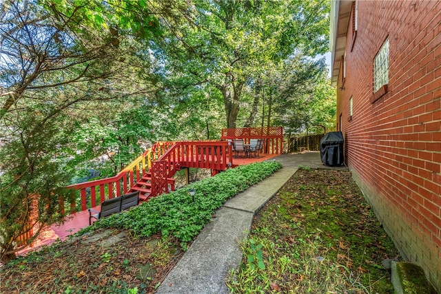 view of yard with a deck