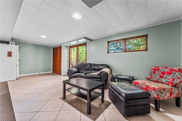 living room with light tile patterned flooring