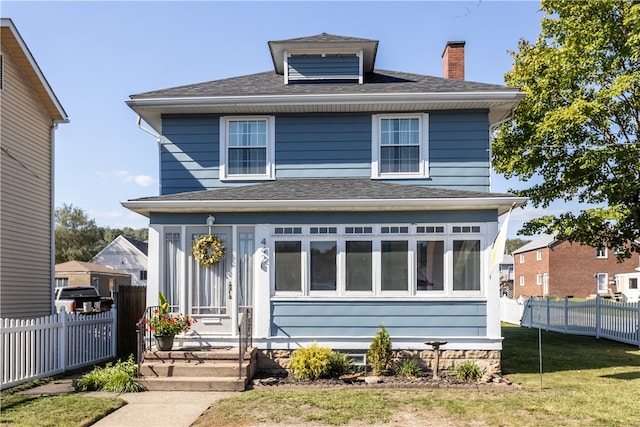 view of front of home featuring a front lawn