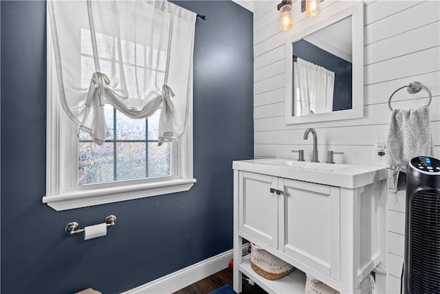 bathroom with hardwood / wood-style flooring and vanity