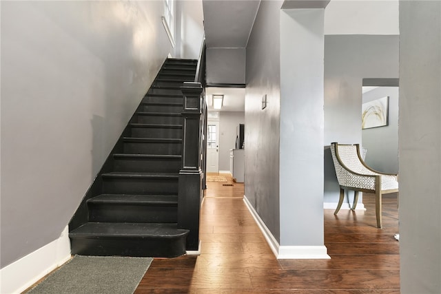 staircase featuring hardwood / wood-style flooring