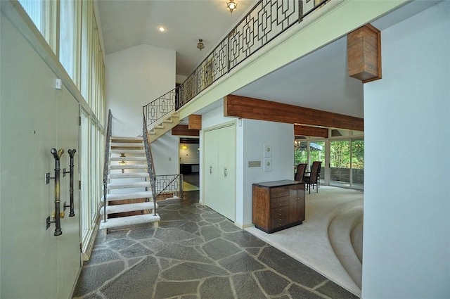 carpeted foyer entrance featuring stairs, high vaulted ceiling, recessed lighting, and baseboards