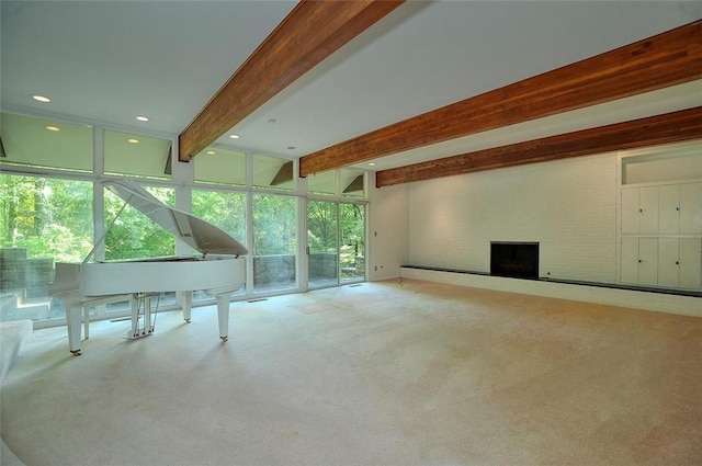 interior space with carpet flooring, a large fireplace, and recessed lighting