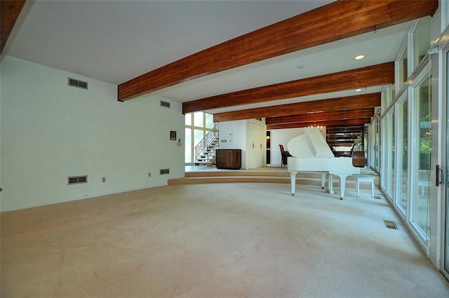 unfurnished living room with stairs, light carpet, beamed ceiling, and recessed lighting