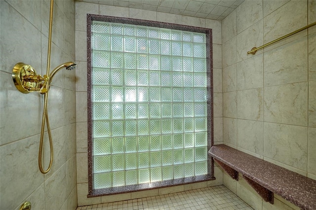 details with tile patterned floors and tiled shower