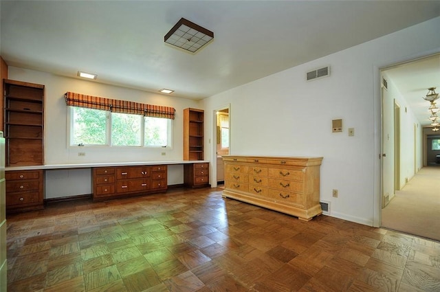unfurnished room featuring baseboards