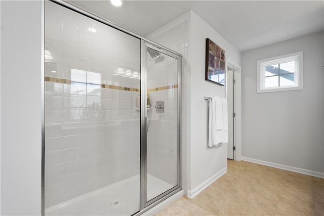 bathroom featuring a shower with door