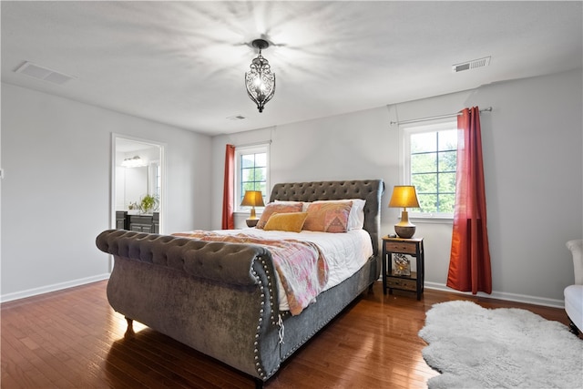 bedroom featuring dark hardwood / wood-style floors