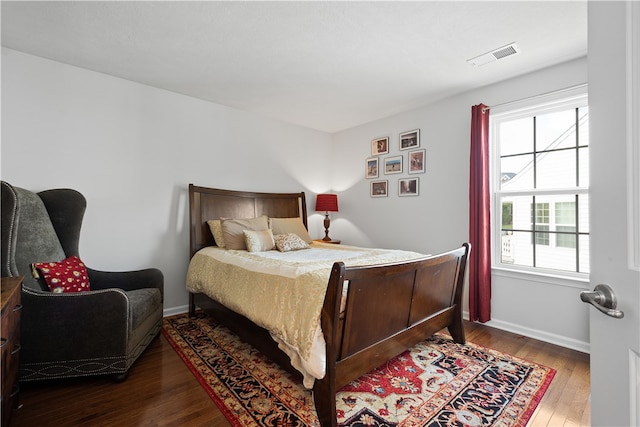 bedroom featuring dark hardwood / wood-style floors