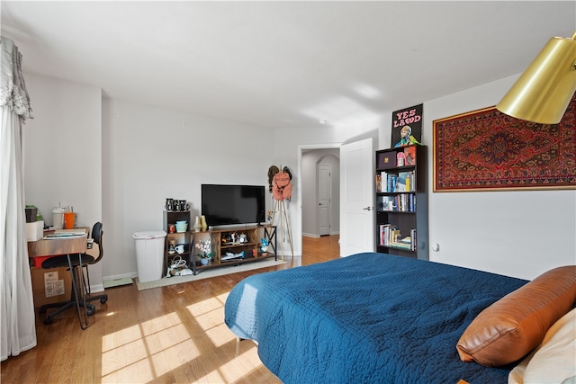 bedroom with hardwood / wood-style floors