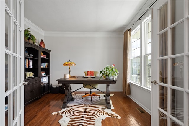 office area with ornamental molding, a wealth of natural light, dark wood-type flooring, and french doors