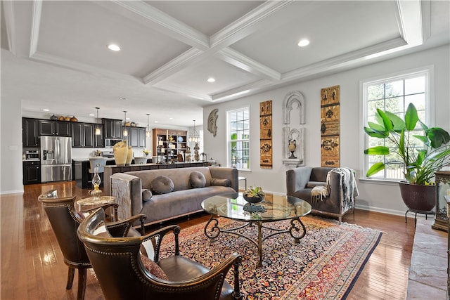 living room with beam ceiling, crown molding, coffered ceiling, and dark hardwood / wood-style floors