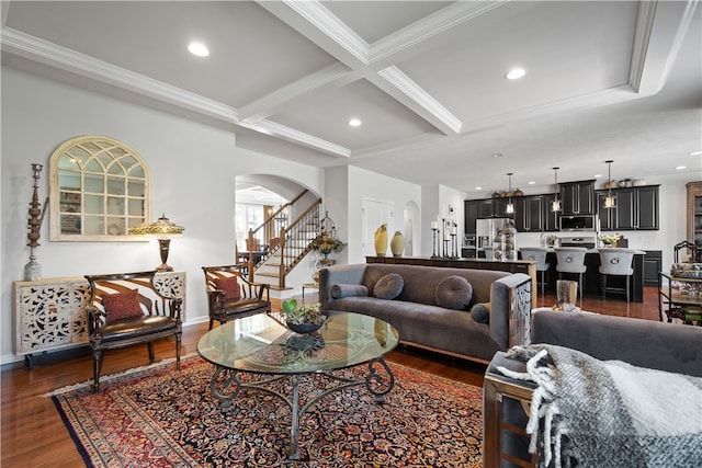 living room with coffered ceiling, ornamental molding, beamed ceiling, and dark hardwood / wood-style flooring