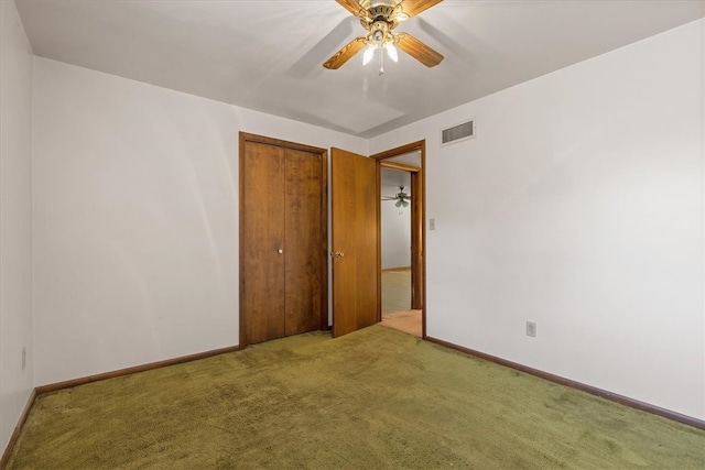 carpeted empty room with ceiling fan