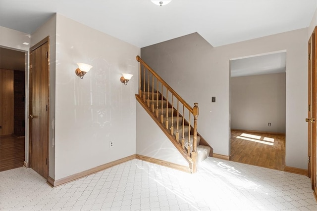 staircase with hardwood / wood-style flooring