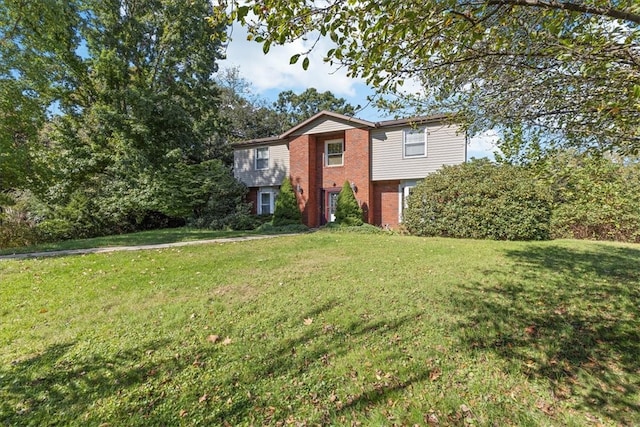 raised ranch featuring a front yard