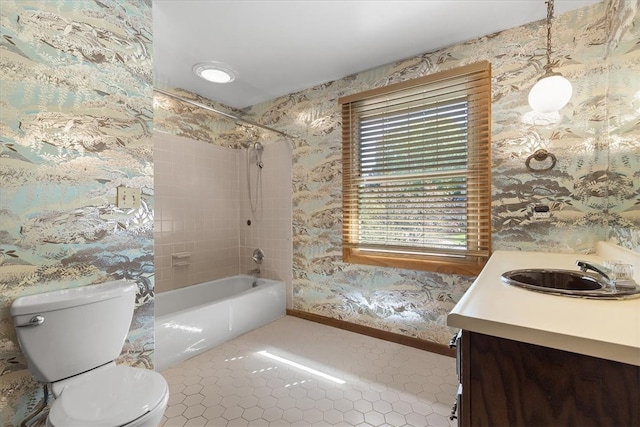 full bathroom with tiled shower / bath combo, tile patterned floors, vanity, and toilet