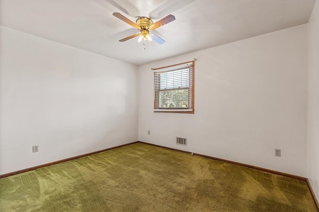 spare room with carpet and ceiling fan