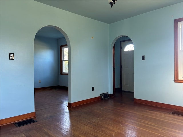 empty room featuring dark hardwood / wood-style floors