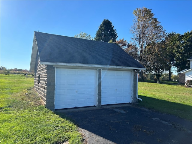 garage featuring a yard