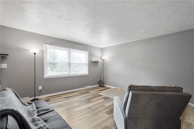 living room with light hardwood / wood-style floors